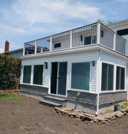 Extension, Sunroom, Siding, Stone, Windows, Deck and Patio Doors on 656 Miller Ave in Freeport, NY